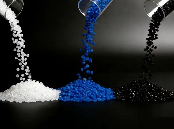 Plastic resin pellets for overmolding material combinations