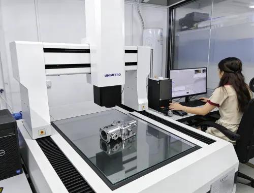 Coordinate measuring machine inspecting die cast part