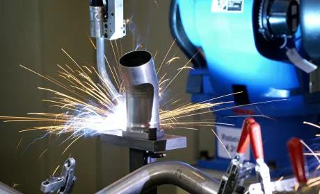 Complex metal assembly during welding with arc and sparks