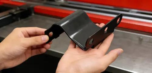 Rapid sheet metal prototype — bent bracket in hands