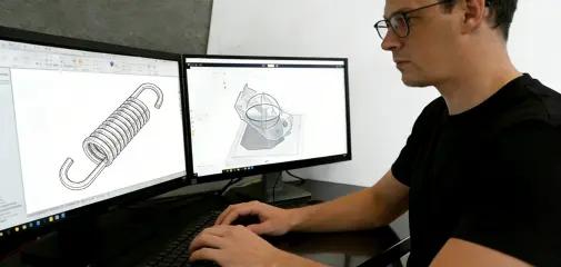 Engineer designing custom spring