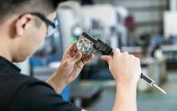 Metrology and validation group inspecting industrial parts